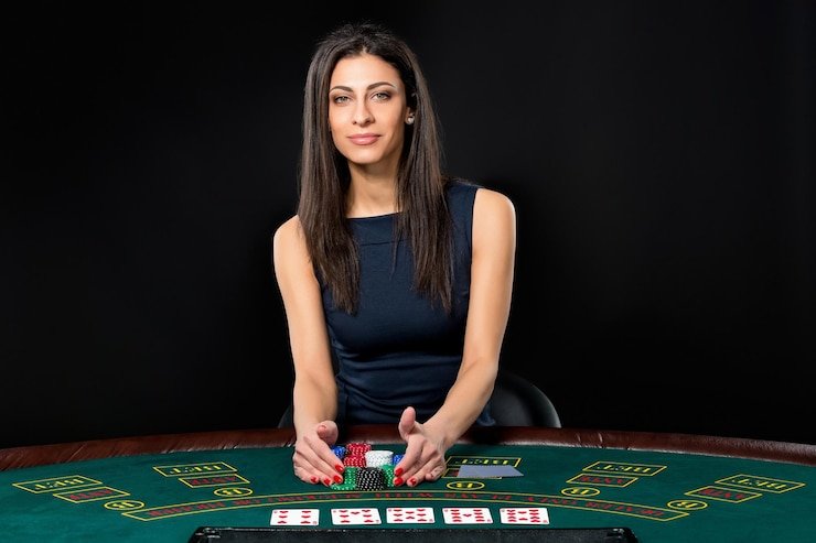 Evolution Gaming live blackjack table with dealer and multiple player positions visible on camera feed